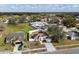 Spacious suburban home with fenced backyard, neighboring houses, and green spaces, perfect for families and outdoor living at 4604 Hunts Ave, Plant City, FL 33566