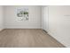 Bedroom features a window and vinyl floors and white trim at 4604 Hunts Ave, Plant City, FL 33566