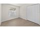 Bedroom features a window, closet, vinyl floors and white trim at 4604 Hunts Ave, Plant City, FL 33566