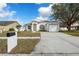 Inviting single-Gathering home with a well-kept lawn, attached garage, and a clear view of the mailbox at 4604 Hunts Ave, Plant City, FL 33566