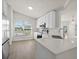 Modern kitchen with stainless steel appliances, quartz counters, and a sunlit breakfast nook at 4604 Hunts Ave, Plant City, FL 33566