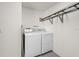Garage laundry area with a set of washer and dryer and shelving for storage at 4604 Hunts Ave, Plant City, FL 33566