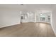 Bright living room featuring stylish wood flooring and neutral color palette at 4604 Hunts Ave, Plant City, FL 33566