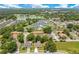Aerial view showcasing the neighborhood, a nearby pond, and well-maintained landscaping at 212 Citrus Landing Dr, Plant City, FL 33563