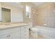 Bright bathroom with shower and tub combination, featuring a single sink vanity at 212 Citrus Landing Dr, Plant City, FL 33563