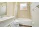 Bright bathroom featuring a combination shower and tub with neutral tile surround at 212 Citrus Landing Dr, Plant City, FL 33563