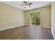 Spacious bedroom with wood floors and natural light from a sliding glass door at 212 Citrus Landing Dr, Plant City, FL 33563