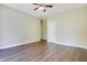 Bedroom with ceiling fan, wood floors, and white trim throughout the room at 212 Citrus Landing Dr, Plant City, FL 33563
