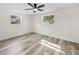 Bright bedroom features a modern ceiling fan, white trim and fresh paint at 4119 Beacon Square Dr, Holiday, FL 34691