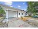 Charming single-story home featuring a driveway with carport and manicured landscaping enhancing its curb appeal at 4119 Beacon Square Dr, Holiday, FL 34691