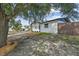 Charming single-story home surrounded by mature trees, offering a serene and private setting at 4119 Beacon Square Dr, Holiday, FL 34691