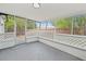 Enclosed patio area with screened walls, offering a bug-free outdoor living space at 4119 Beacon Square Dr, Holiday, FL 34691