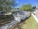 Aerial view showcases the home's roof, driveway, and surrounding fenced yard at 4601 Copper Ln, Plant City, FL 33566