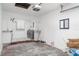 Unfinished garage featuring a laundry area, with washer and dryer, as well as a window at 2239 Worrington St, Sarasota, FL 34231