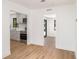 View of the open layout from the living room to the kitchen with stainless steel appliances at 2239 Worrington St, Sarasota, FL 34231