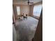 Bedroom featuring a ceiling fan, two windows, and neutral walls ready for renovation at 3607 Johnson Ct, Palm Harbor, FL 34684