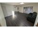 Spacious living room with dark wood floors and plenty of natural light at 5356 Royal Palm Ave # 5356, Sarasota, FL 34234