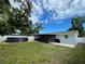 Spacious backyard features a dark-colored above ground pool and a screened patio at 9153 86Th Ave, Seminole, FL 33777