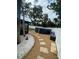 Backyard with above ground pool, stepping stone walkway, and white vinyl fence at 9153 86Th Ave, Seminole, FL 33777
