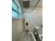 Bathroom features a shower/tub combo with sleek gold hardware and bright natural light at 9153 86Th Ave, Seminole, FL 33777