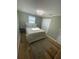 Cozy bedroom with wood floors and natural lighting at 9153 86Th Ave, Seminole, FL 33777