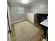 Neutral bedroom includes a white dresser, office space, and a decorative area rug at 9153 86Th Ave, Seminole, FL 33777