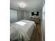 Bedroom with a TV, dresser, and closet at 9153 86Th Ave, Seminole, FL 33777