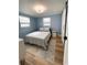 Bedroom with blue walls and a closet at 9153 86Th Ave, Seminole, FL 33777