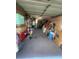 Spacious garage with an open door, featuring ample storage and potential parking space, easily accessible for homeowners at 9153 86Th Ave, Seminole, FL 33777