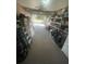 Spacious garage with an open door, featuring ample storage and access to the outdoors at 9153 86Th Ave, Seminole, FL 33777