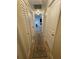 Hallway with doors and a decorative runner rug at 9153 86Th Ave, Seminole, FL 33777