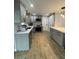 Beautifully remodeled kitchen with modern cabinets, quartz countertops, stainless steel appliances, and pendant lighting at 9153 86Th Ave, Seminole, FL 33777