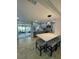 Modern kitchen with gray cabinets, an island with seating, stainless steel appliances, and lots of light at 9153 86Th Ave, Seminole, FL 33777