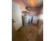 Functional laundry room with essential appliances including a washer, dryer and a hot water heater, for convenient chores at 9153 86Th Ave, Seminole, FL 33777