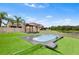 Well-maintained backyard features an above-ground pool, gazebo, and artificial turf at 14095 Tropical Kingbird Way, Riverview, FL 33579
