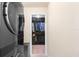 A laundry room with updated washer/dryer units, leading into walk in closet at 14095 Tropical Kingbird Way, Riverview, FL 33579