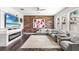 Cozy living room with a fireplace, modern decor, and ample natural light at 14095 Tropical Kingbird Way, Riverview, FL 33579