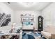 This well-lit office space features modern furniture and decor, with a large Eiffel Tower print on the wall at 14095 Tropical Kingbird Way, Riverview, FL 33579