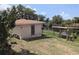 Home's backyard features a covered dock with access to calm waters, combining nature and convenience at 155 Summerset Dr, Punta Gorda, FL 33982