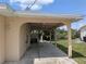 A spacious carport area offers covered parking and a glimpse of the canal view at 155 Summerset Dr, Punta Gorda, FL 33982