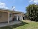 Exterior view features a DirectTV satellite dish, air conditioning units and the home's canal side at 155 Summerset Dr, Punta Gorda, FL 33982
