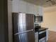 A modern kitchen showcasing stainless steel appliances and bright white cabinets at 155 Summerset Dr, Punta Gorda, FL 33982