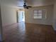 Living room with tile floor, open door and window allowing for natural light at 155 Summerset Dr, Punta Gorda, FL 33982