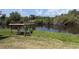 Backyard with a covered dock by the water, offering peaceful views and direct water access at 155 Summerset Dr, Punta Gorda, FL 33982