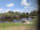 Scenic waterfront view featuring a private dock, enhancing the property's appeal with access to the water at 155 Summerset Dr, Punta Gorda, FL 33982