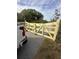 Newly constructed wooden gate with hardware and a 'beware of dog' sign at 37951 Washington Loop Rd, Punta Gorda, FL 33982