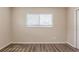 Bedroom featuring wood-look flooring and neutral paint illuminated by bright windows at 4111 13Th S Ave, St Petersburg, FL 33711