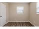 A bright bedroom featuring neutral walls and modern wood-look floors for a clean aesthetic at 4111 13Th S Ave, St Petersburg, FL 33711