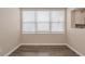 Cozy dining area illuminated by bright windows, complemented by neutral walls and wood-look flooring at 4111 13Th S Ave, St Petersburg, FL 33711