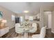 Cozy dining area with a glass-top table open to the kitchen, perfect for entertaining at 4111 13Th S Ave, St Petersburg, FL 33711